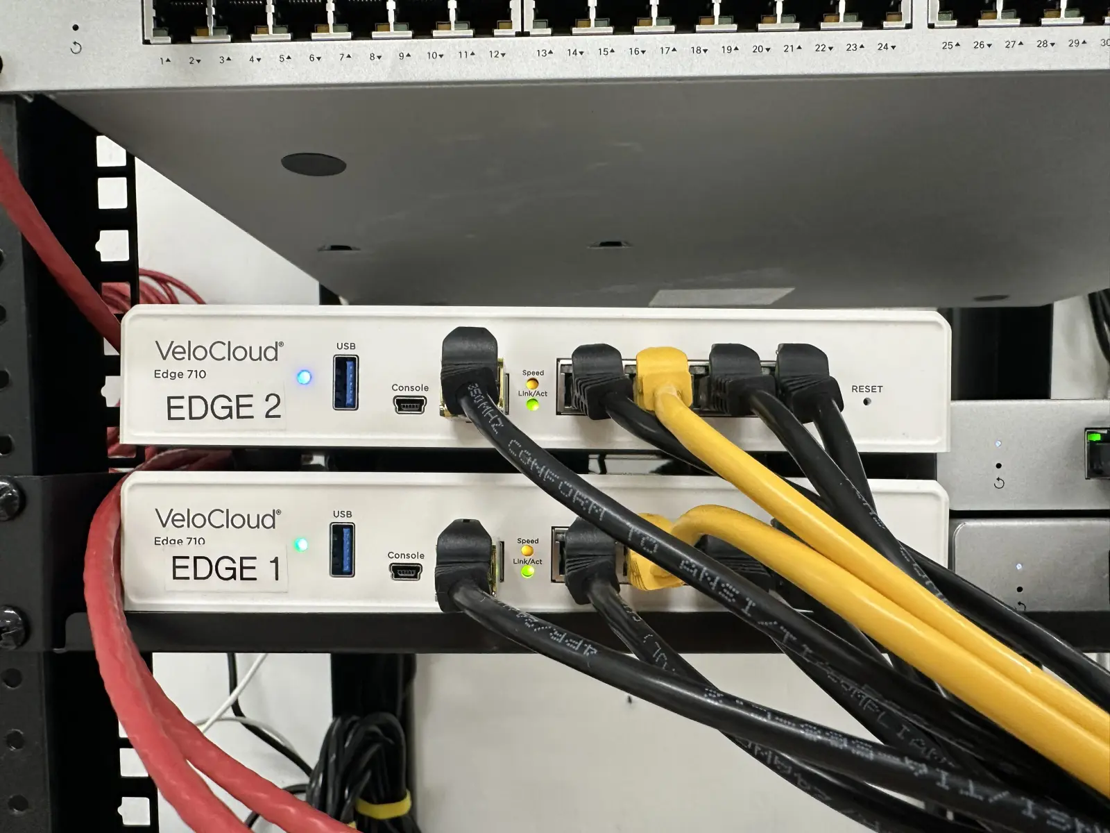 Dual SD-WAN VeloCloud edge devices mounted in rack