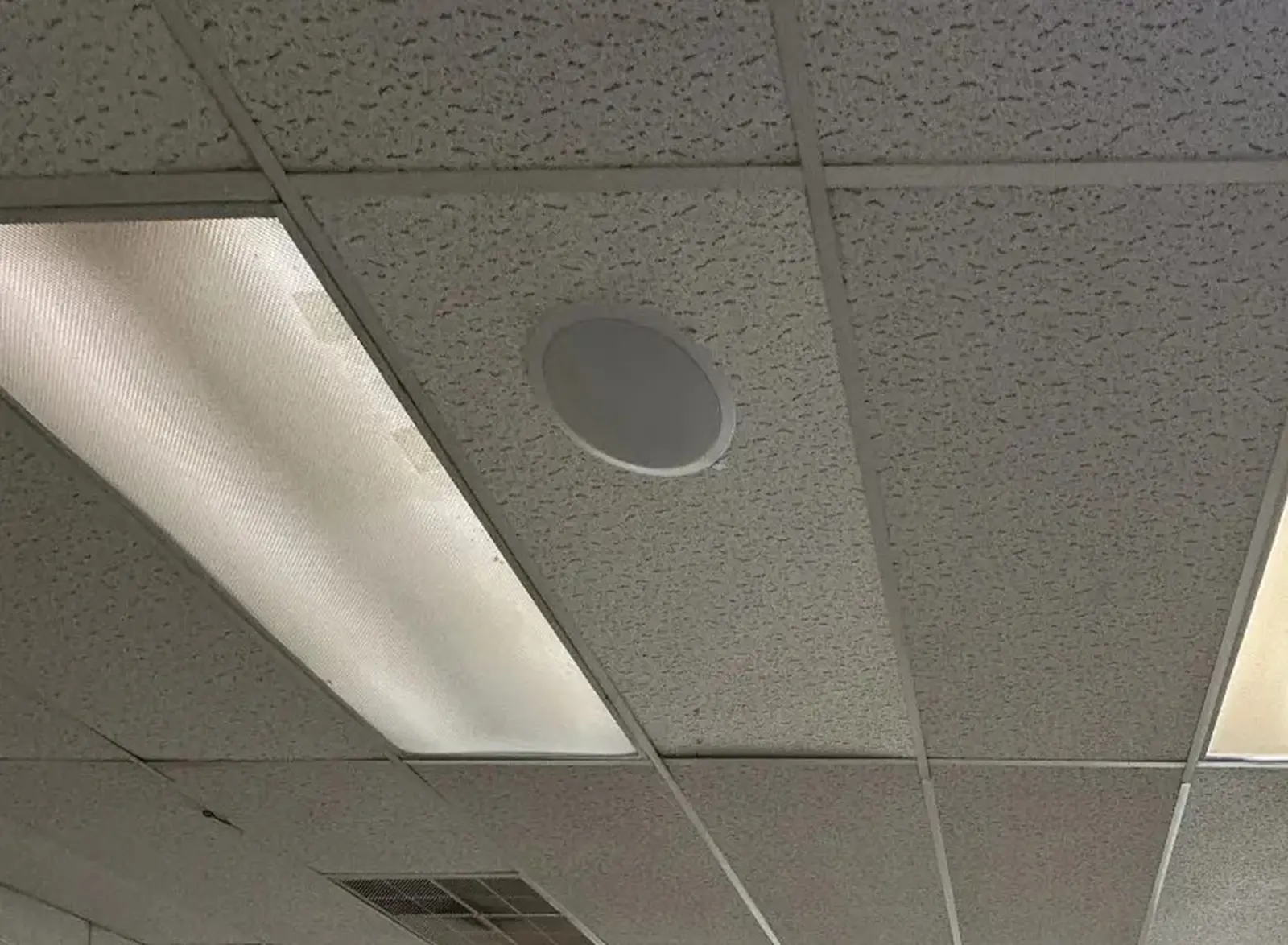 Retail ceiling speaker installation in active commercial space